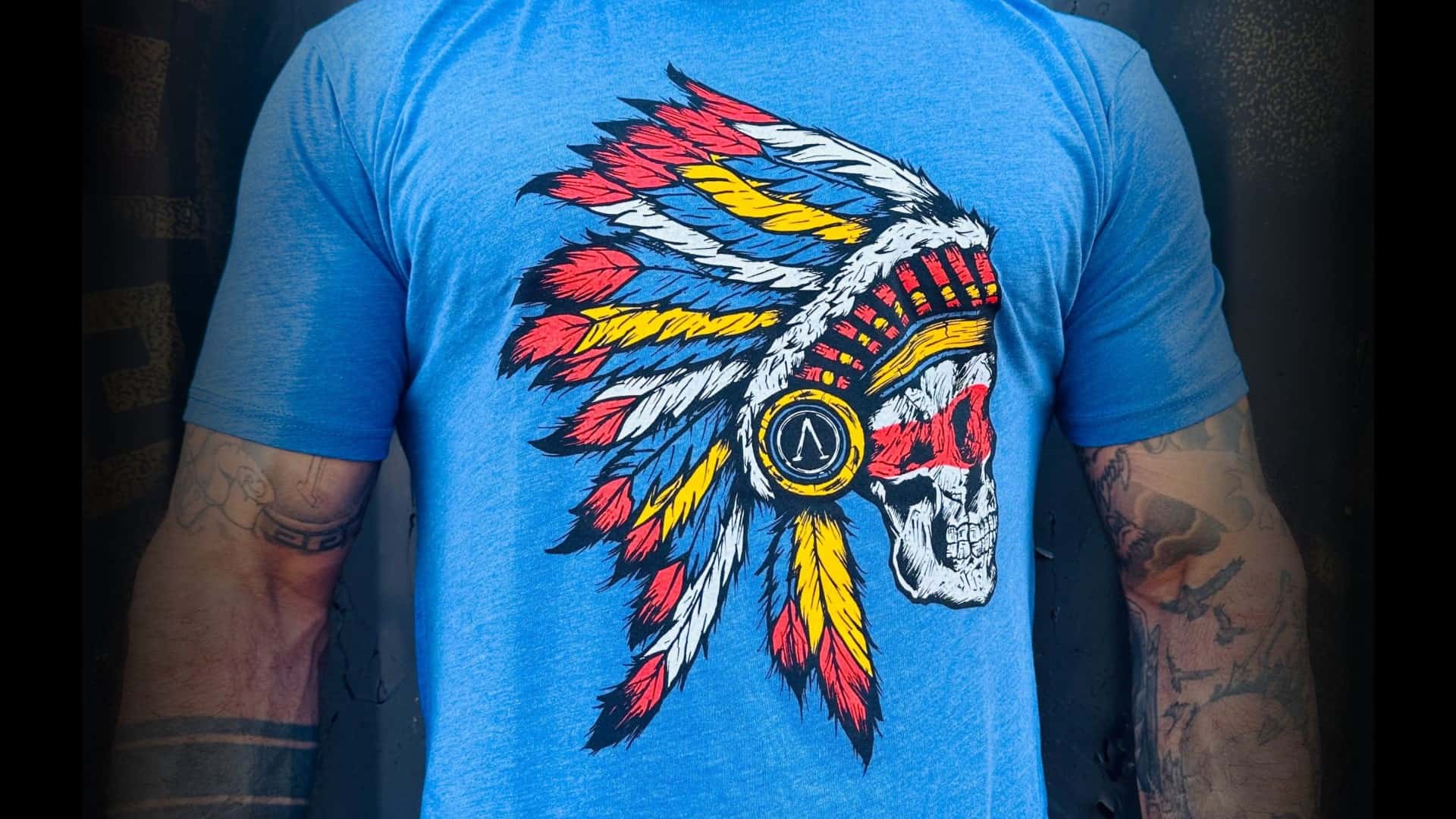 blue shirt with skull wearing headress